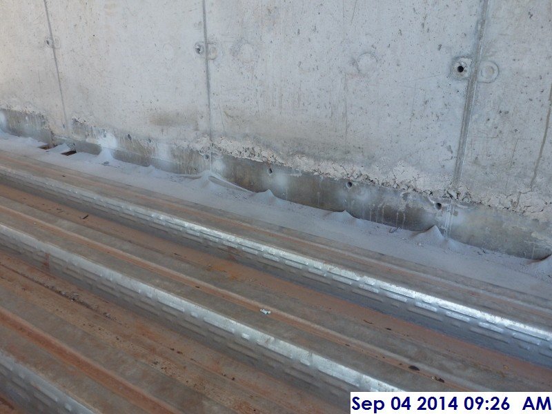 Drilled holes at the Shear walls prepping for the slab on deck Facing East (800x600)